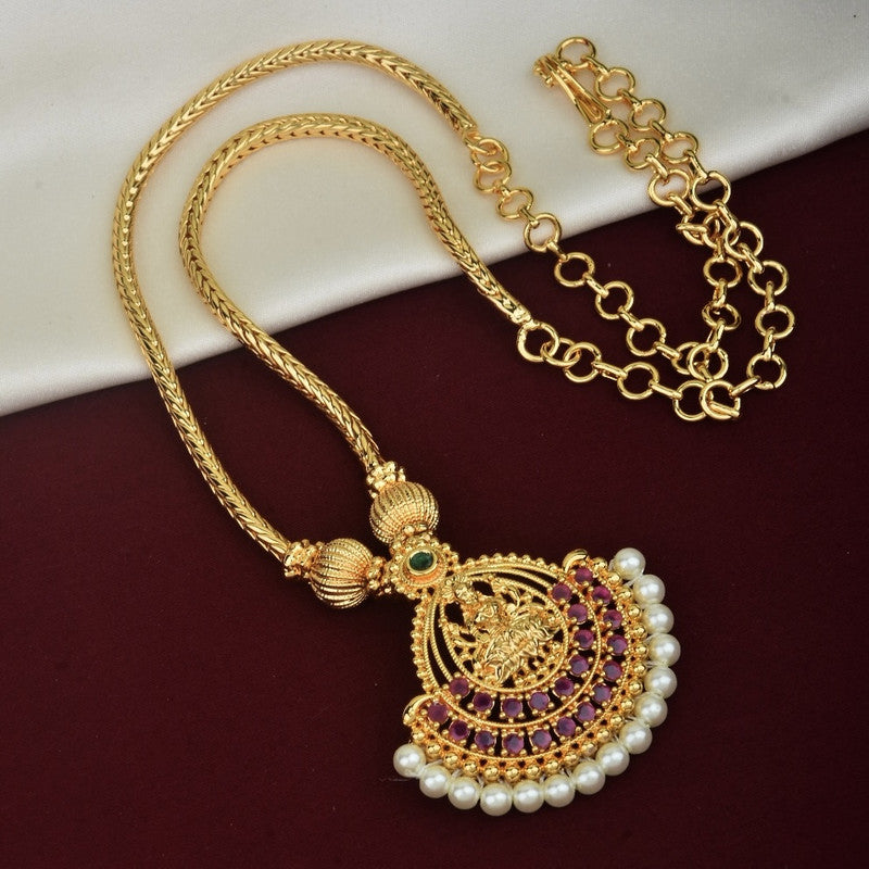 Gold necklace with intricate pendant design featuring purple stones, pearls, and a central green stone.