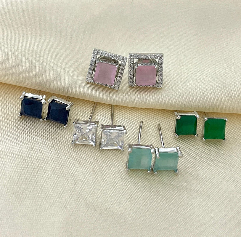 A collection of square stud earrings in various colors, including pink, blue, clear, green, and light green, each set in a silver frame.