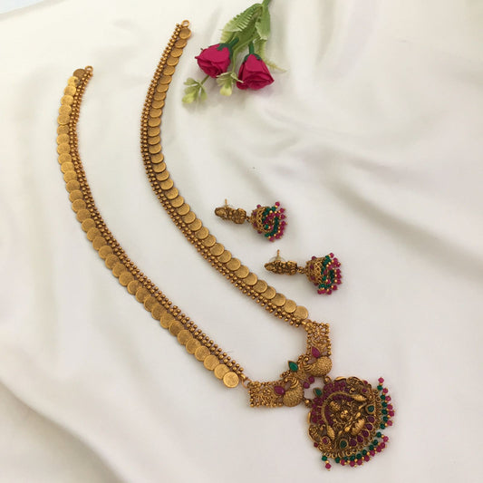 Gold coin necklace set with matching earrings, featuring intricate designs and red and green accents.