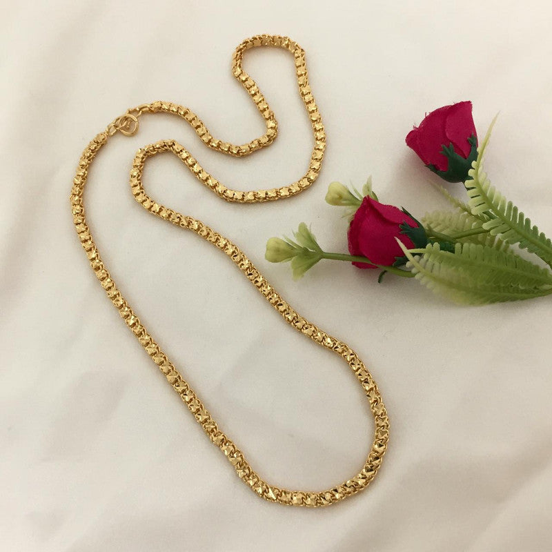 A gold chain necklace displayed on a white surface.