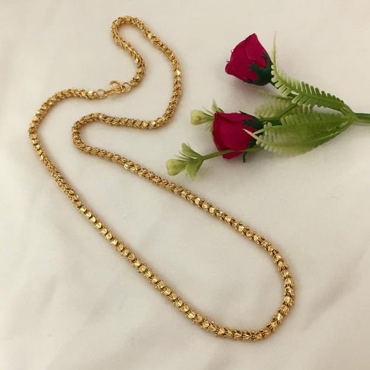 A gold chain necklace with a textured design.