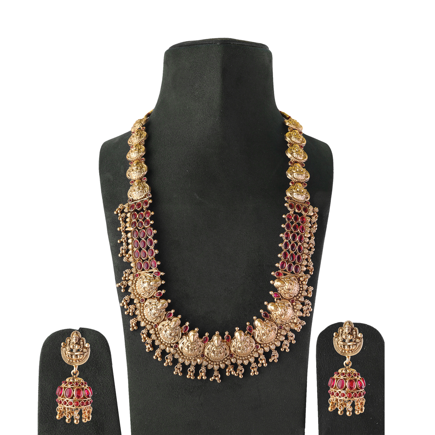 Gold necklace with intricate designs and matching earrings displayed on a black stand.