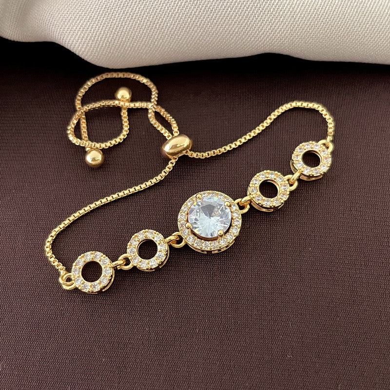 A gold bracelet with a central large round gemstone and four smaller circular links, each encrusted with smaller gemstones.