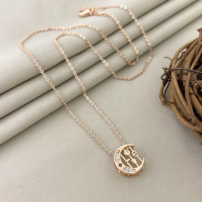 A gold necklace with a pendant featuring the word "Love" and small embedded crystals.