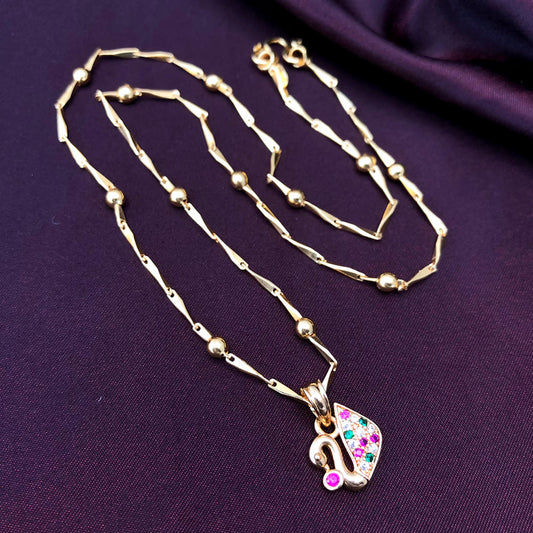 A gold necklace with a swan-shaped pendant adorned with colorful gemstones.