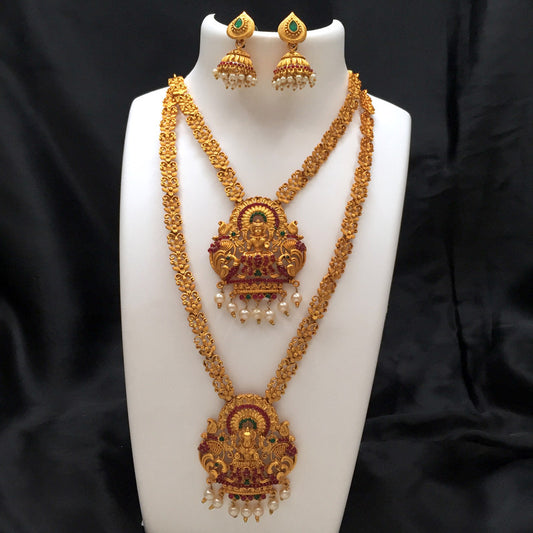 Gold necklace set with intricate designs, featuring two long necklaces with matching earrings, adorned with red and green gemstones and pearl accents.