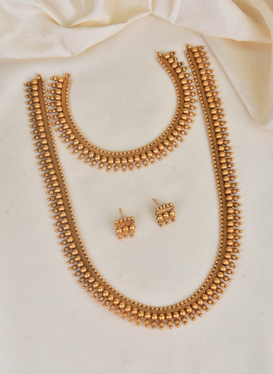 Gold-toned traditional necklace set with matching earrings.