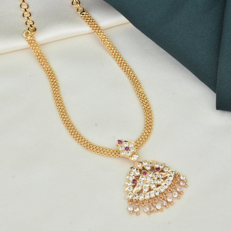 A gold necklace with a pendant featuring intricate designs and embedded with colorful gemstones.