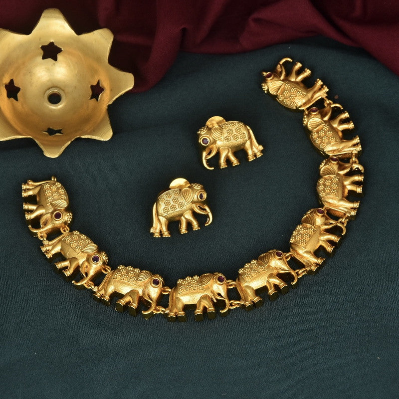 A gold-toned elephant-themed jewelry set consisting of a necklace and a pair of earrings.