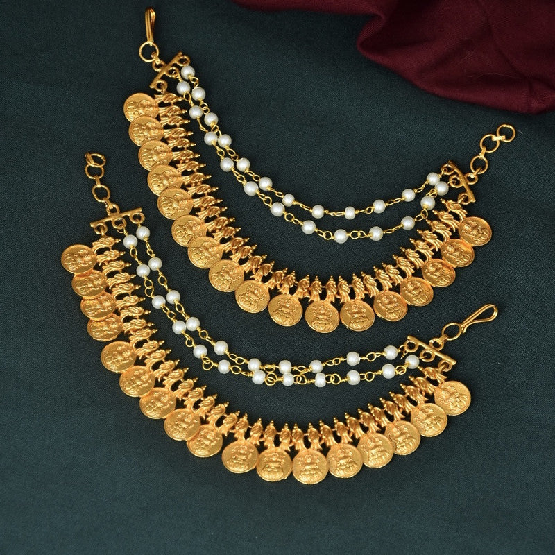 Gold coin and pearl anklets with intricate chain design.