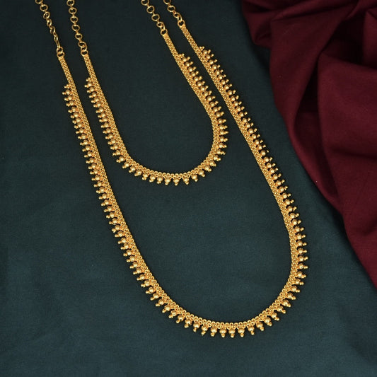 Two gold necklaces with intricate designs.