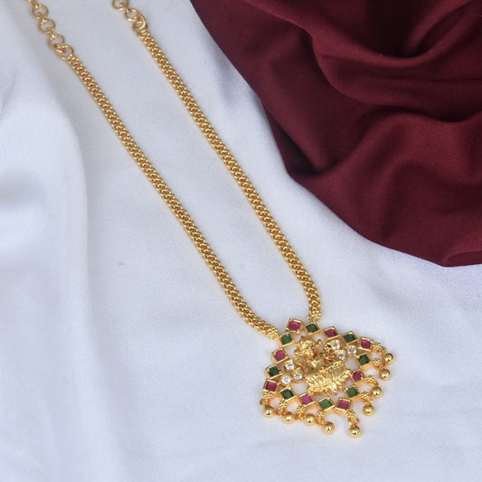 Gold chain necklace with an intricate pendant featuring colorful gemstones and small dangling beads.